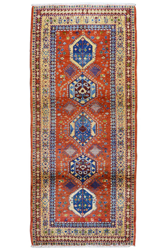 Shiraz rug with a vertical medallion pattern, red-orange, blue and yellow-beige
