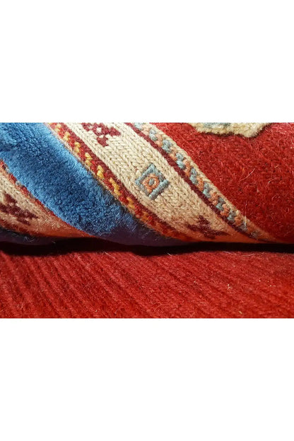 Carpet detail with red and blue weave structure and an integrated pattern
