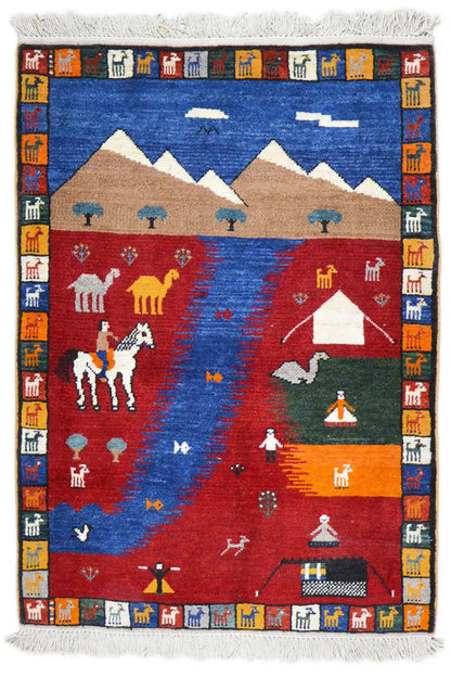 Gabbeh rug with a multicolored design in blue, red, and beige, with fringes