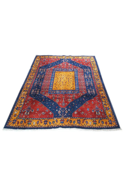 Gabbeh rug with a red, blue, and yellow medallion pattern, short fringe.