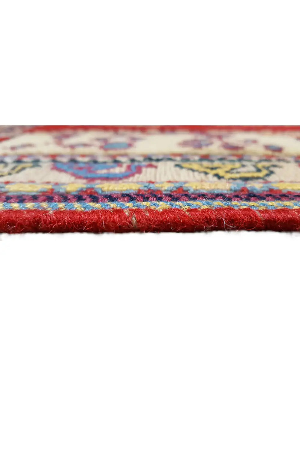 Soumak rug: Detail of the colorful border with a dense pile texture and fringe along the edge.