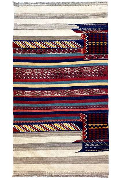 Kilim rug with horizontal stripes and diamonds in blue, red, and beige, with fringe