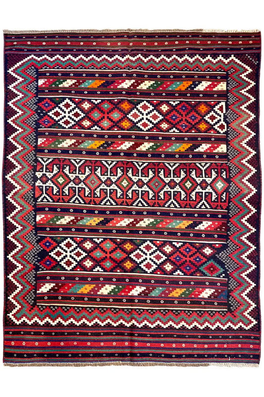 Complete kilim rug: central ornaments, zigzag border, and stripes in red, blue, and green.