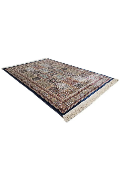 Machine-woven rug, spread out with a beige fringed edge and geometric ornamental pattern
