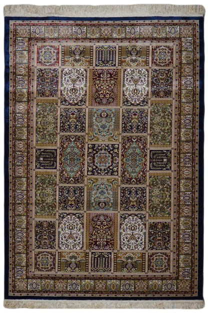 Machine-woven rug with a geometric patchwork pattern and colorful border, beige/blue