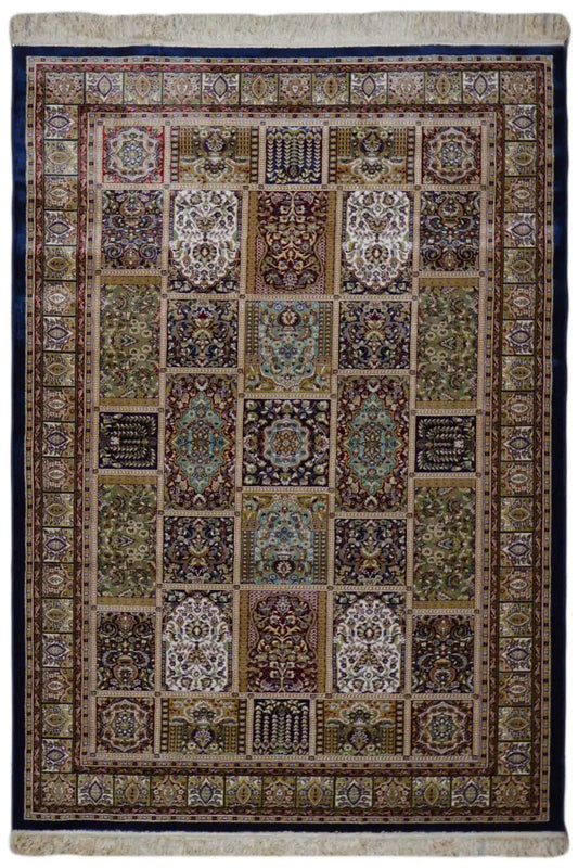Machine-woven rug with a geometric patchwork pattern and colorful border, beige/blue