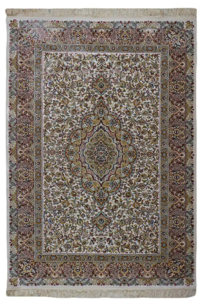 Machine-woven rug with an ornamental medallion pattern, surrounding border, and fringes