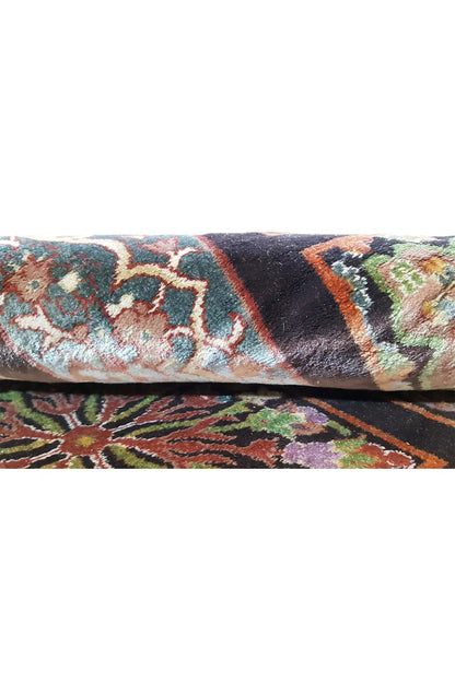 Carpet edge in detail with a multicolored pattern and dark underside
