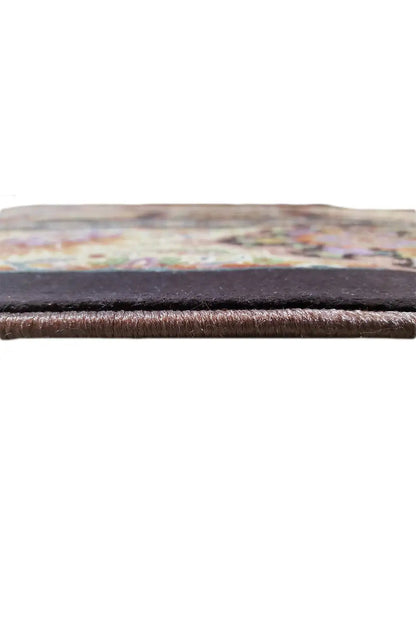 Carpet edge in close-up: even weave structure, dark backing, low pile