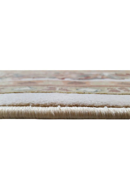 Machine-woven rug 300x200 cm, close-up of the edge with fringe and beige pile