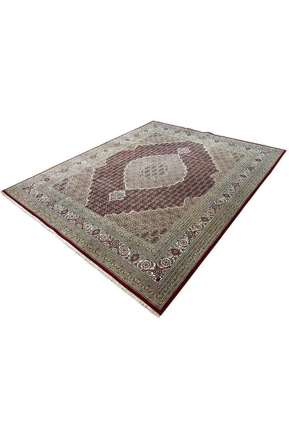 Indo Tabriz rug, diagonal view with central medallion in brown and beige