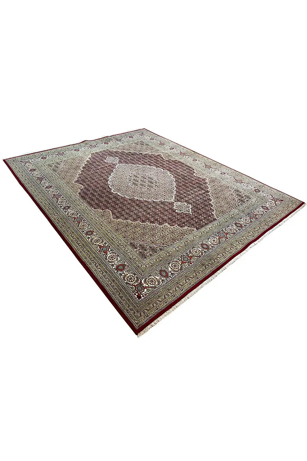 Indo Tabriz rug, angled, with a medallion and ornamental border