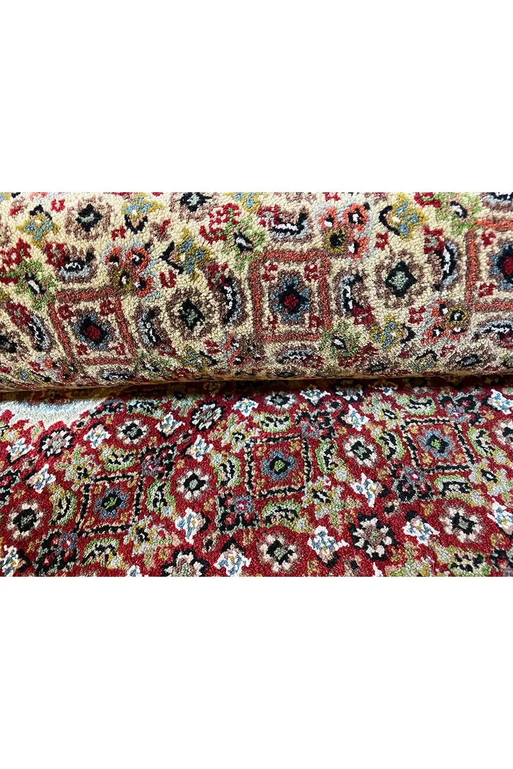 Carpet with a colorful floral and vine pattern in red, green, and blue