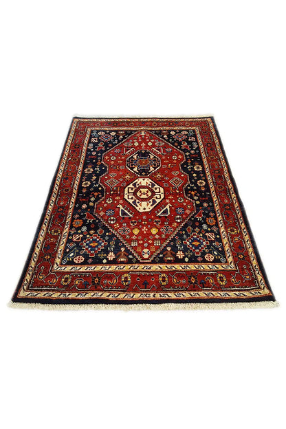 Dark red rectangular rug with a dark central medallion and geometric pattern