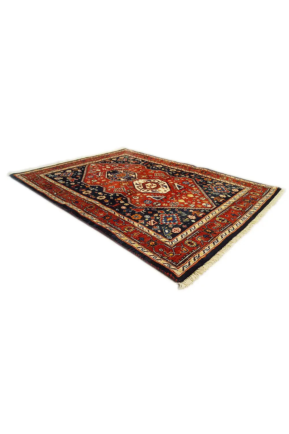 Rectangular rug with a red border pattern and blue central medallion, diagonal