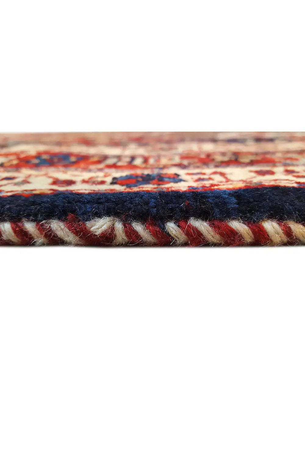 Oriental rug edge with a dark border and multicolored trim