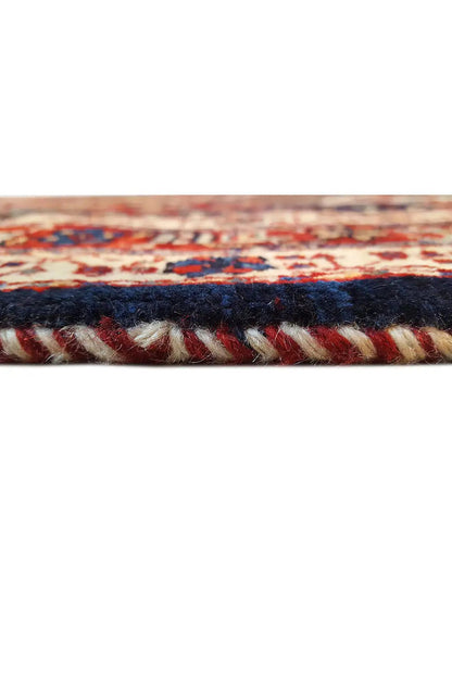 Oriental rug edge with a dark border and multicolored trim
