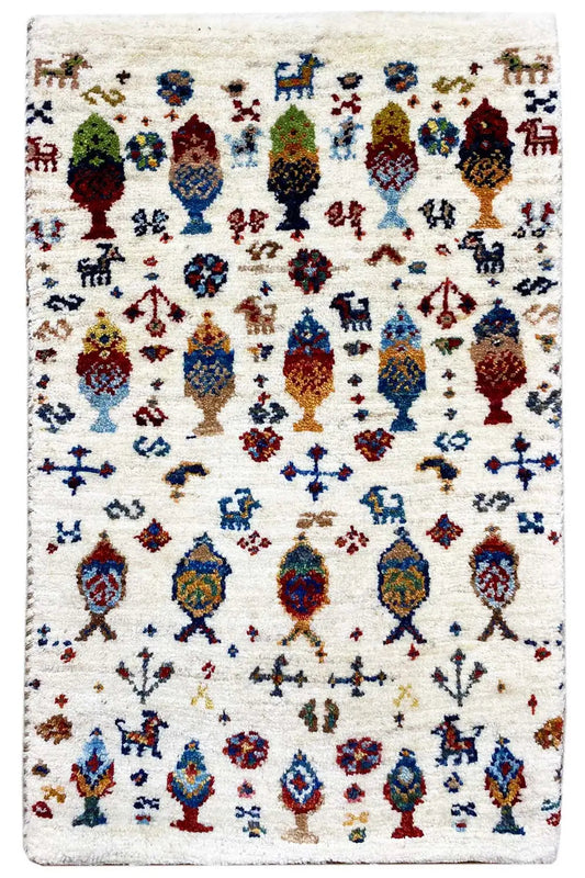 Gabbeh rug 58x37 cm rectangular, cream with colorful bird and figure motifs.