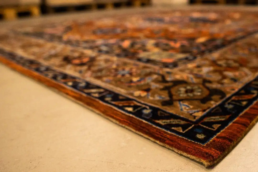 Tea corner with a multicolored ornamental border, dark blue frame, and copper tones
