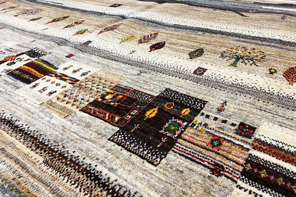 Close-up: Carpet pattern with ornamental elements and colorful details on a light background