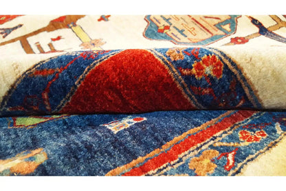 Close-up of an oriental rug: red and blue pattern on a cream-colored background, textured pile
