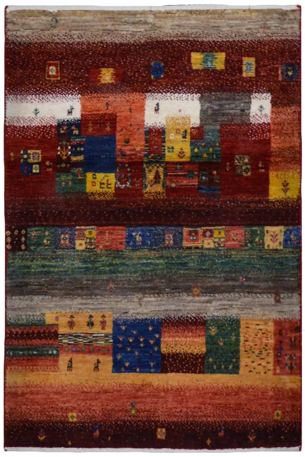 Gabbeh rug with a red patchwork design and multicolored geometric patterns.