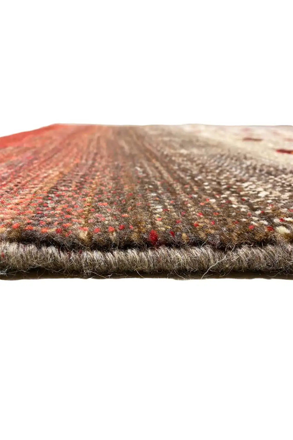 Gabbeh rug detail edge, red-beige textured surface with colored dots along the edge
