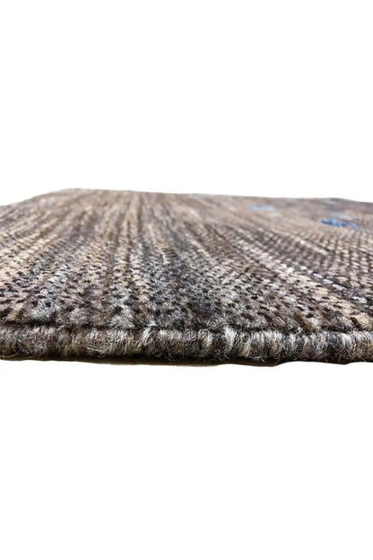 Gabbeh rug 128x82 cm, close-up of the edge with a dark border and dense weaving