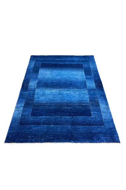 Blue Gabbeh rug with large rectangular patchwork, arranged lengthwise