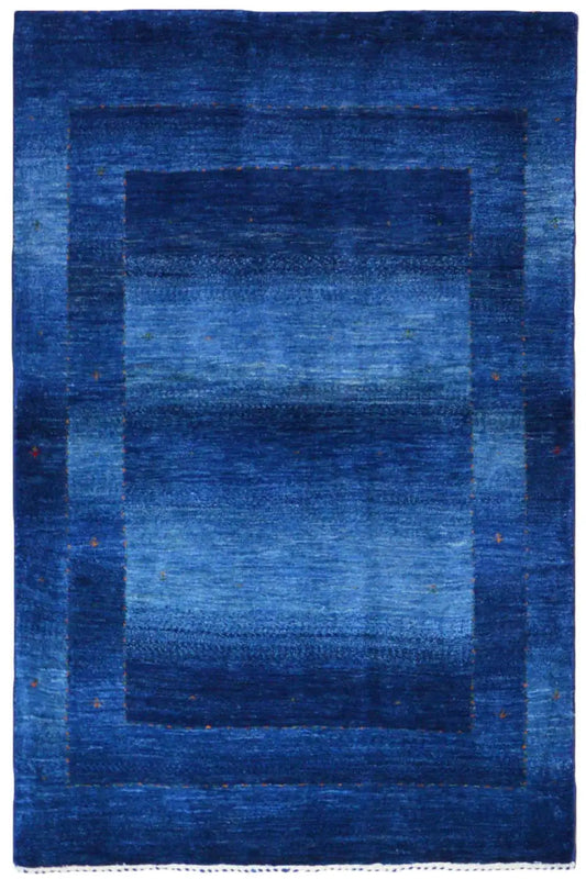 Blue Gabbeh rug with a rectangular patchwork pattern and wide border