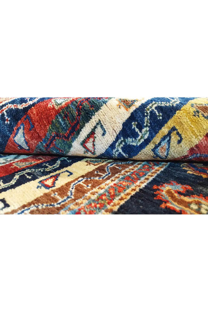 Oriental rug detail with colorful geometric patterns and dense pile
