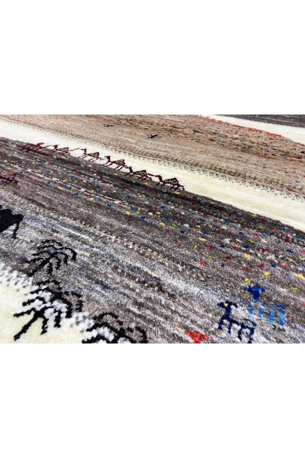 Gabbeh rug (132x84 cm) detail view: dark border with colorful accents and figures