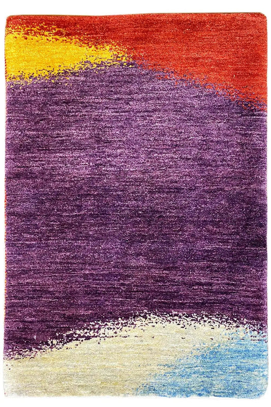 Rectangular Gabbeh rug: purple with a red top border, yellow flecks, and a blue-and-white fringe