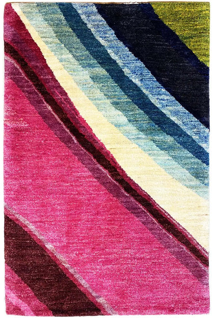 Gabbeh rug with diagonal stripes, vibrant pink, blue, cream, and dark gray