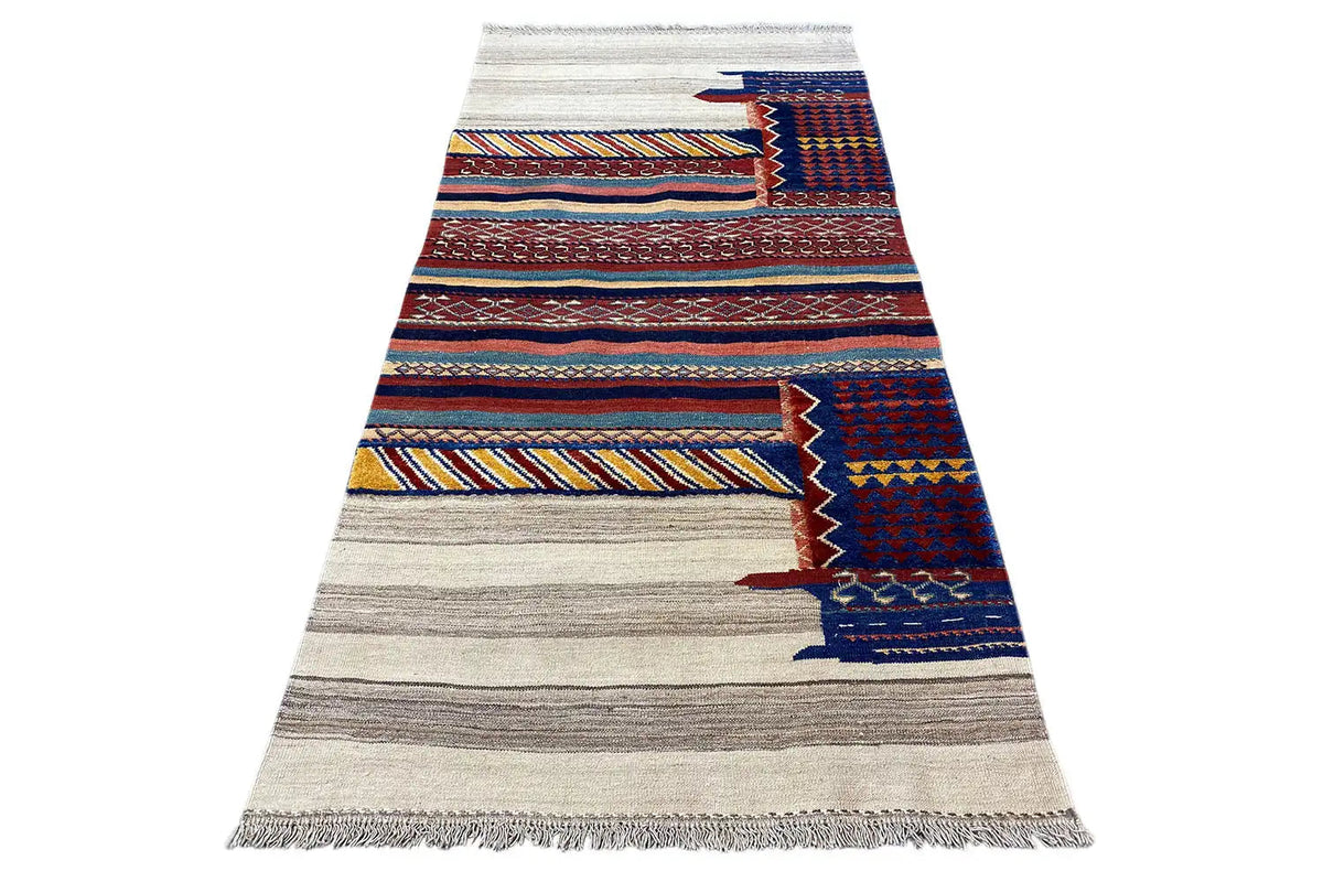 Elongated Bakhtiari kilim with striped and diamond patterns in blue, red, and beige, with fringes