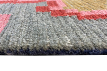 Designer rug with gray pile and colorful patterned areas in red and blue