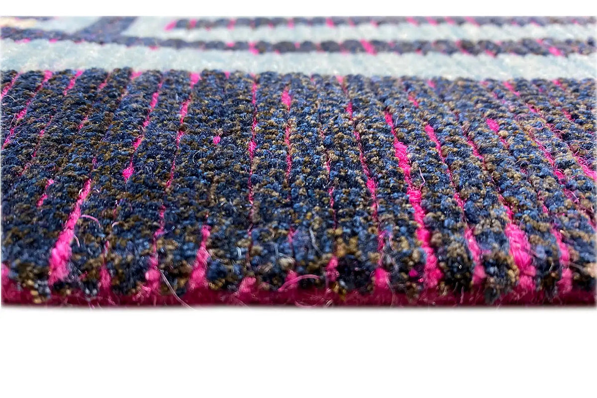 Rug pile with multicolored low pile and fringes, blue, purple, and pink accents