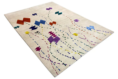 Beige rug with abstract colored lines and rectangular shapes