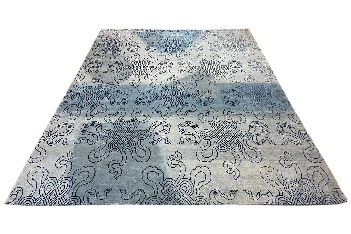 Designer rug with Bo-Hamsa ornaments in light gray and blue, spread out