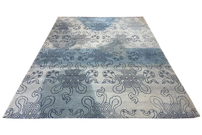 Designer rug with Bo-Hamsa ornaments in light gray and blue, spread out