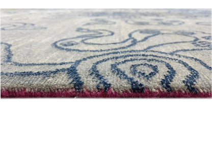 Designer rug: detailed edge with a blue pattern and colorful fringe trim
