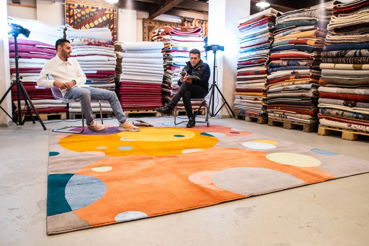 Large rug with a polka-dot pattern in orange, yellow, blue, and gray