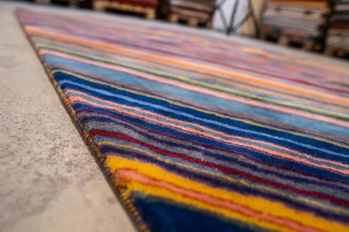 Close-up: multicolored stripes with yellow and red accents on the carpet