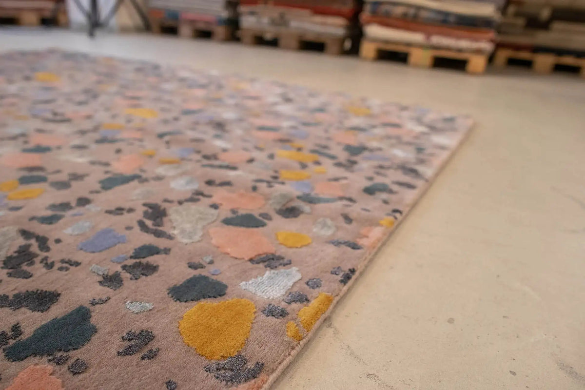 Designer rug Terrazzo by Pascal Walter, corner view with colorful terrazzo fragments
