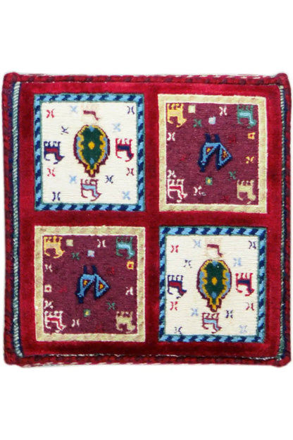 Square Soumak rug with a red border and four colorful tile motifs.