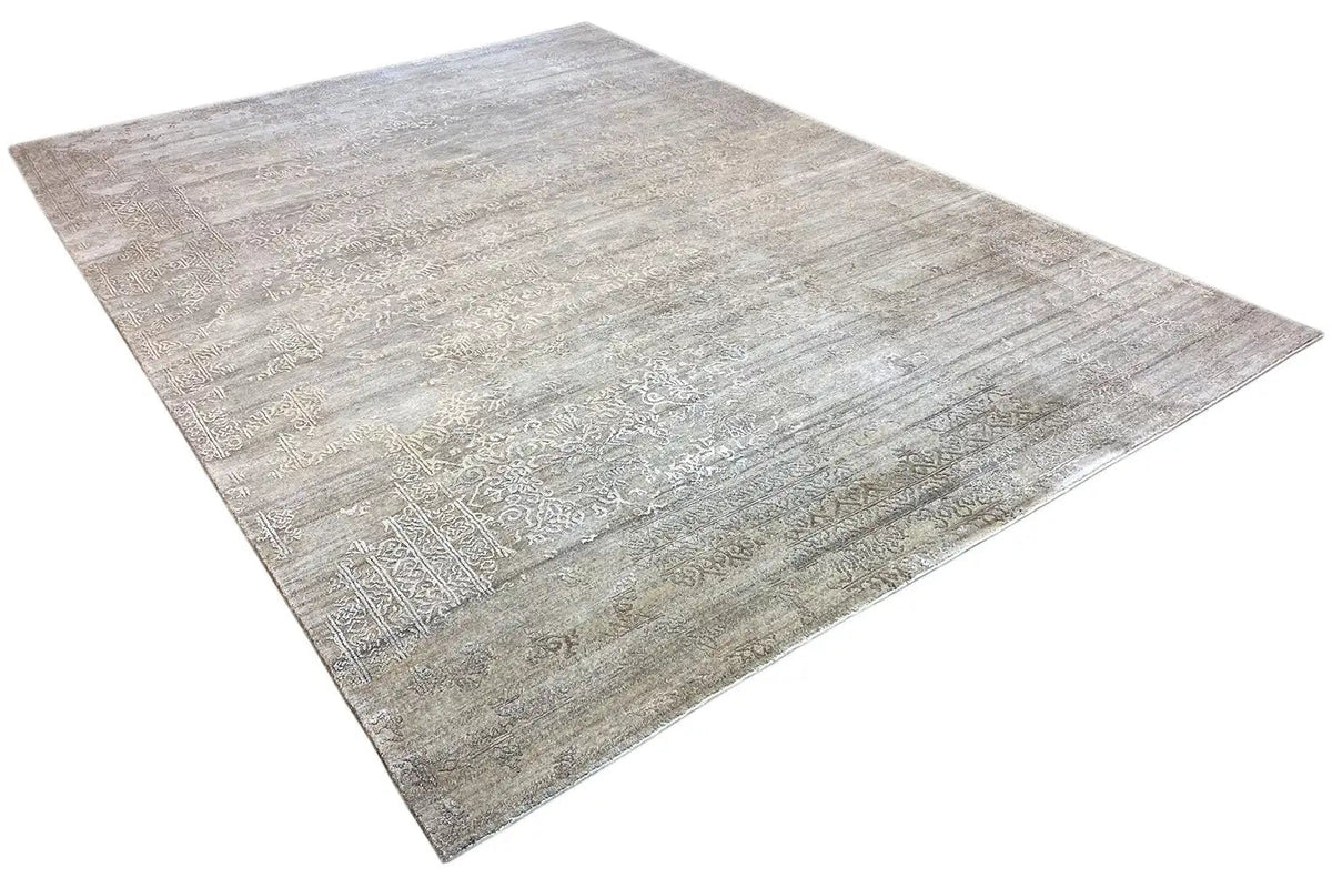 Rectangular light gray rug with subtle ornamentation, generous pile
