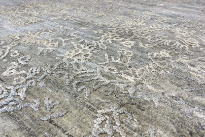 Rug detail: woven-in patterns in light gray, beige, and gold accents