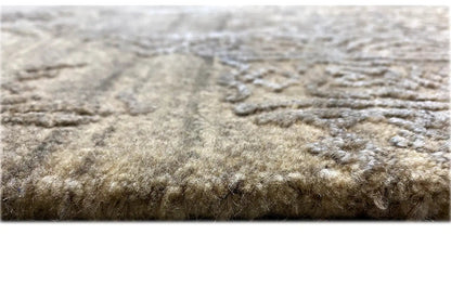 Rug with a dense, short pile, light gray-beige coloring with a shadow effect