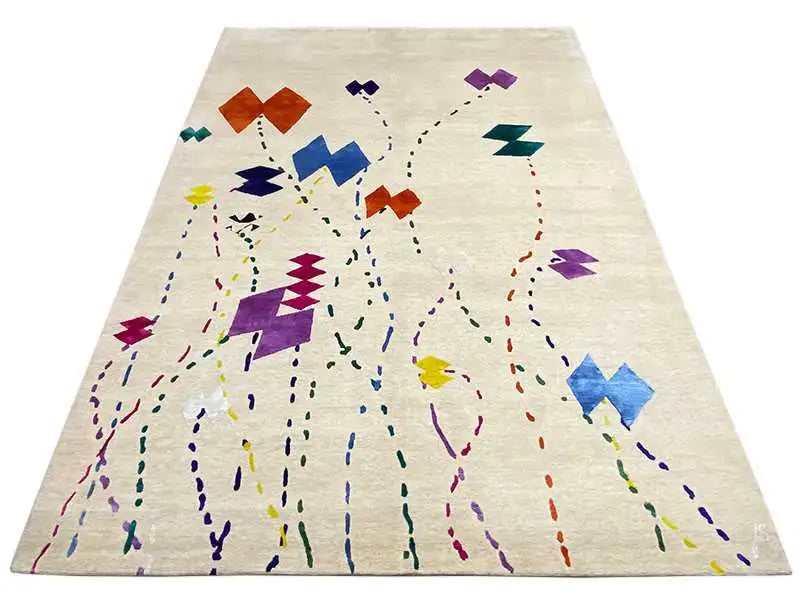 Beige rug with a large abstract pattern of lines and color blocks