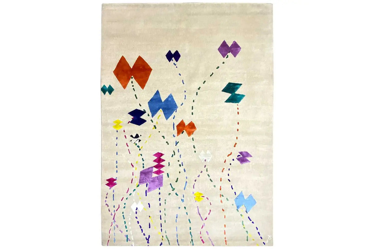 Rectangular beige rug with an abstract pattern of colorful dots